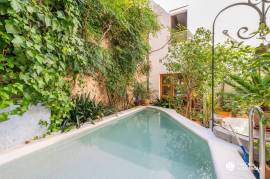 Historic house with stone facade and pool