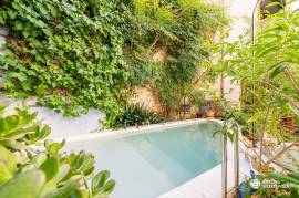 Historic house with stone facade and pool
